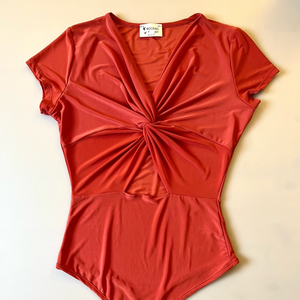 New, Mocking Jay Red Coral Stretchy Short Sleeves V-Neck Bodysuit. Size Small.